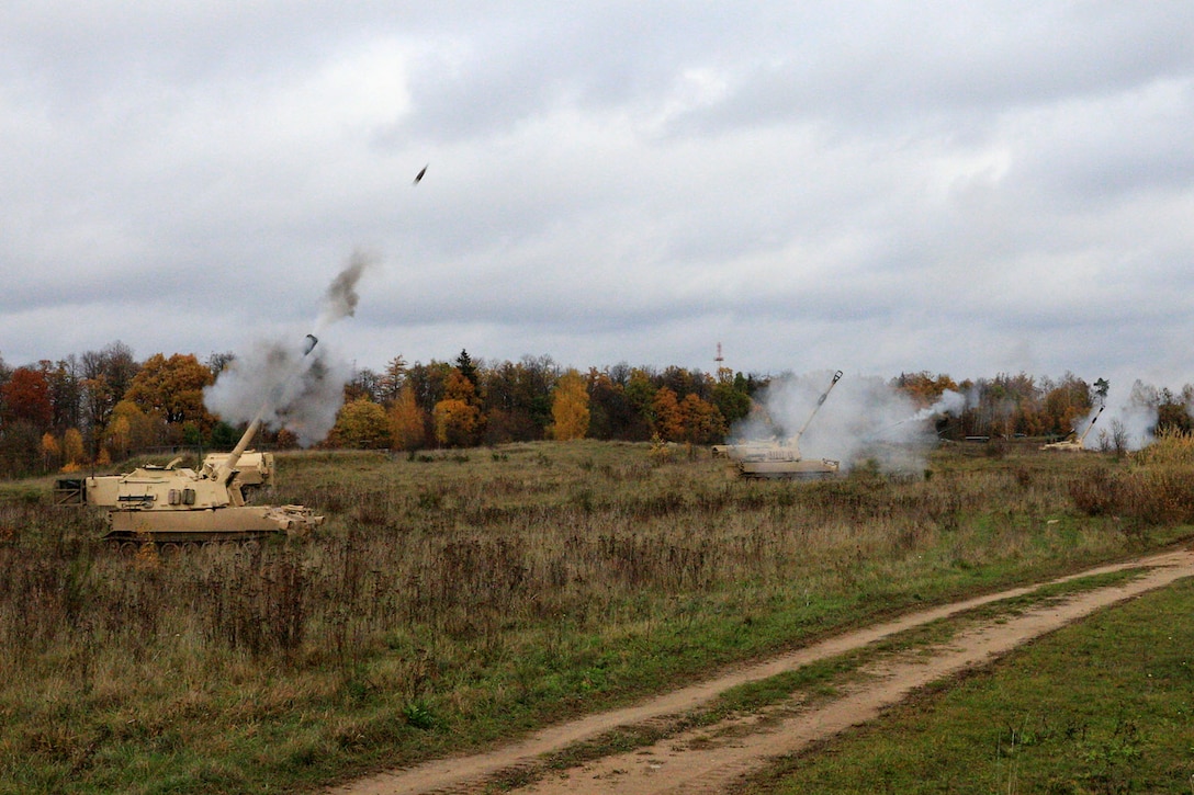 U.S. and foreign soldiers conduct a live-fire exercise.