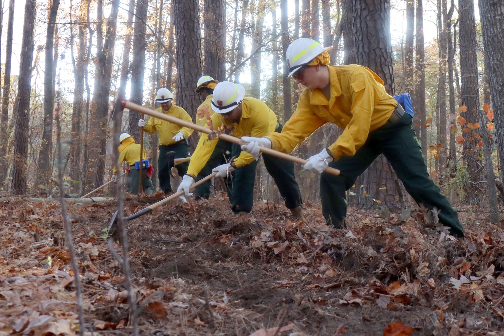 Virginia National Guard Soldiers and Airmen conduct the field day exercise portion of wildland firefighter training with the Virginia Department of Forestry Nov. 12, 2023, at Fort Barfoot, Virginia. They focused on basic tools, familiarization with bulldozers and engines, fireline construction and proper fire shelter use.