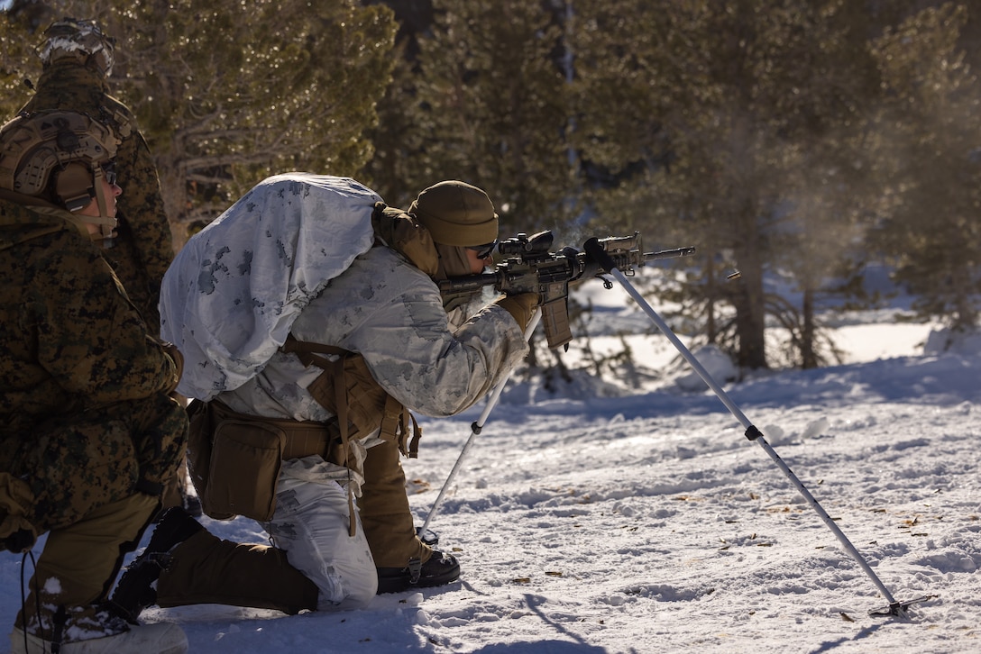 A U.S. Marine with 2d Battalion, 8th Marine Regiment, 2d Marine Division fires his rifle during Mountain Warfare Training Exercise 2-23 on Marine Corps Mountain Warfare Training Center, Bridgeport, California, Jan. 28, 2023. MTX prepares units to survive and conduct extended operations in mountainous terrain during the winter. (U.S. Marine Corps photo by Lance Cpl. Ryan Ramsammy)