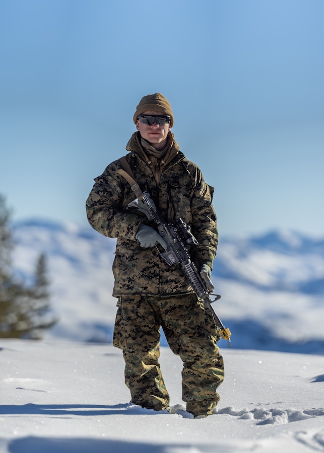 U.S. Marine Corps Lance Cpl. Vlad Vanhorn, a Smyrna, Georgia, native and anti tank missile gunner with 2d Battalion, 8th Marine Regiment, 2d Marine Division poses for a photo during Mountain Warfare Training Exercise 2-23 on Marine Corps Mountain Warfare Training Center, Bridgeport, California, Jan. 24, 2023. “I was adopted by an American family at the age of thirteen,” said Vanhorn. “My parents fostered a sense of patriotism to America. I joined to give back for everything the country has done for me.” MTX prepares units to survive and conduct extended operations in mountainous terrain during the winter. (U.S. Marine Corps photo by Lance Cpl. Ryan Ramsammy)