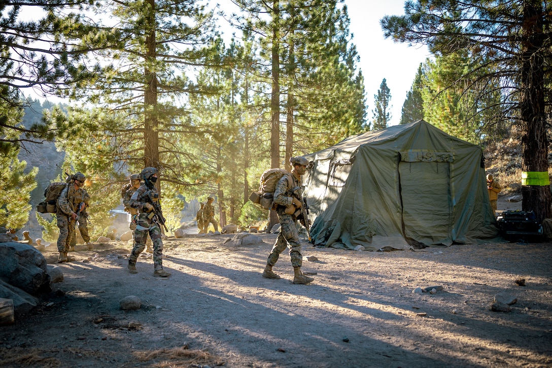 U.S. Marines with 2nd Battalion, 5th Marine Regiment, 1st Marine Division, patrol during a simulated cliff assault as part of Mountain Exercise 1-24 at Marine Corps Mountain Warfare Training Center, Bridgeport, California, Oct. 20, 2023. Marine Air-Ground Task Force Training Command is directly involved in joint efforts to develop, test, and improve standards to provide for joint interoperability. (U.S. Marine Corps photo by Lance Cpl. Richard PerezGarcia)