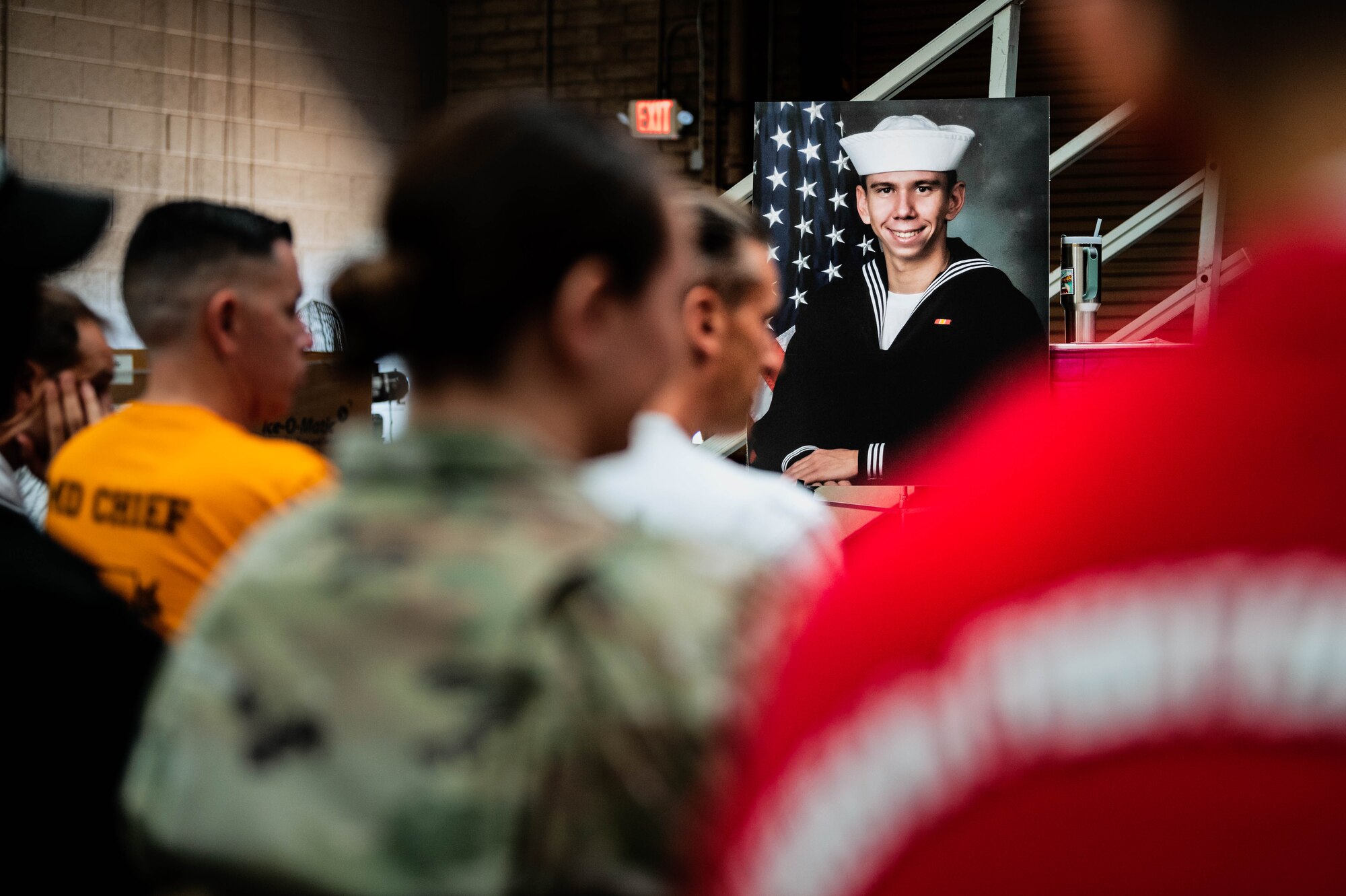 56th Fighter Wing personnel listen to a resiliency Airmen-to-Airmen event about the life and death of U.S. Navy Petty Officer 3rd Class Brandon Caserta.