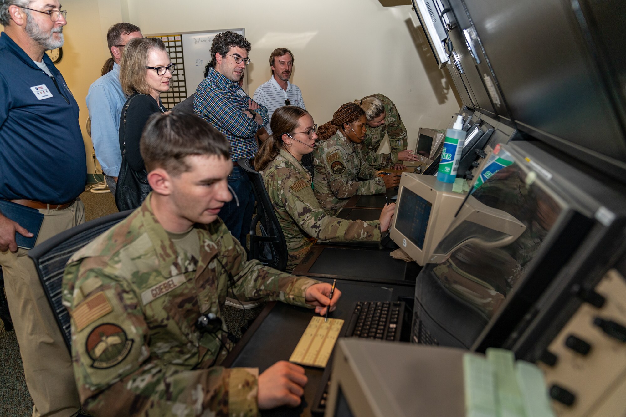 Community and local business leaders watch as 334th Training Squadron Airmen give a demonstration on air traffic control activities during the Leadership Gulf Coast tour at Keesler Air Force Base, Mississippi, Nov. 9, 2023.
