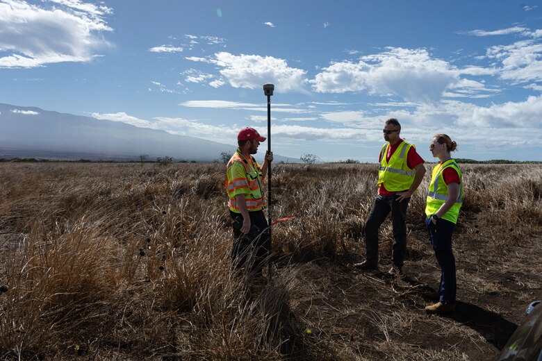 The U.S. Army Corps of Engineers, temporary housing, mission specialist, Anne Wurtenberger and mission manager Jeff McCullick visit with surveyor Stephen Caldwell at a proposed temporary housing site map. (U.S. Army photo by Brigida I. Sanchez)