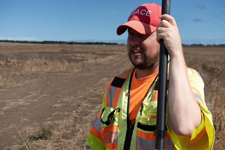 The U.S. Army Corps of Engineers, temporary housing, mission specialist, Anne Wurtenberger and mission manager Jeff McCullick visit with surveyor Stephen Caldwell (pictured here) at a proposed temporary housing site map. (U.S. Army photo by Brigida I. Sanchez)