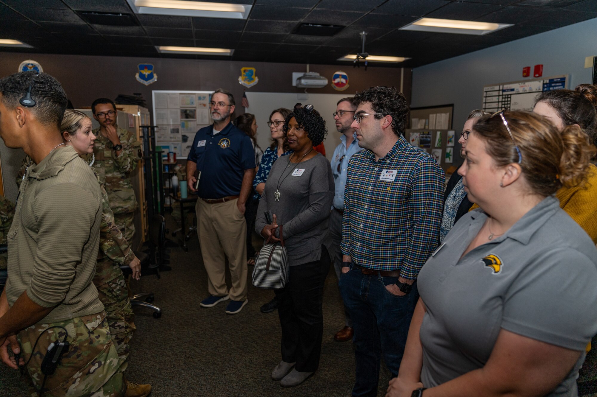 Community and local business leaders watch as 334th Training Squadron Airmen give a demonstration on air traffic control activities during the Leadership Gulf Coast tour at Keesler Air Force Base, Mississippi, Nov. 9, 2023.