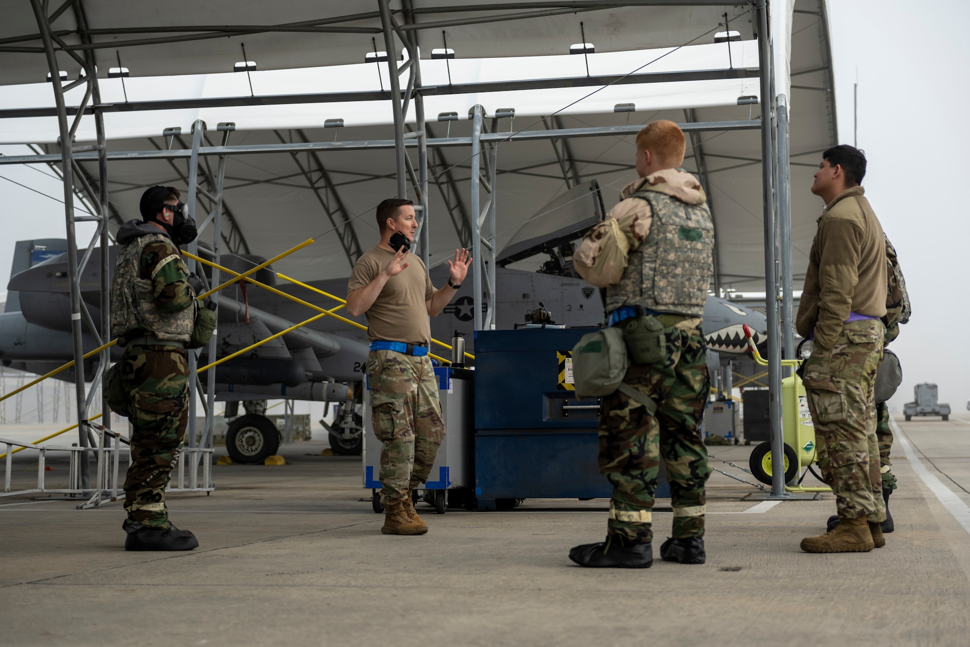 U.S. Air Force Tech. Sgt. Jaymes Melvin, middle left, 74th Fighter Generation Squadron aircraft section chief, speaks with maintenance Airmen at Moody Air Force Base, Georgia, Nov. 9, 2023.