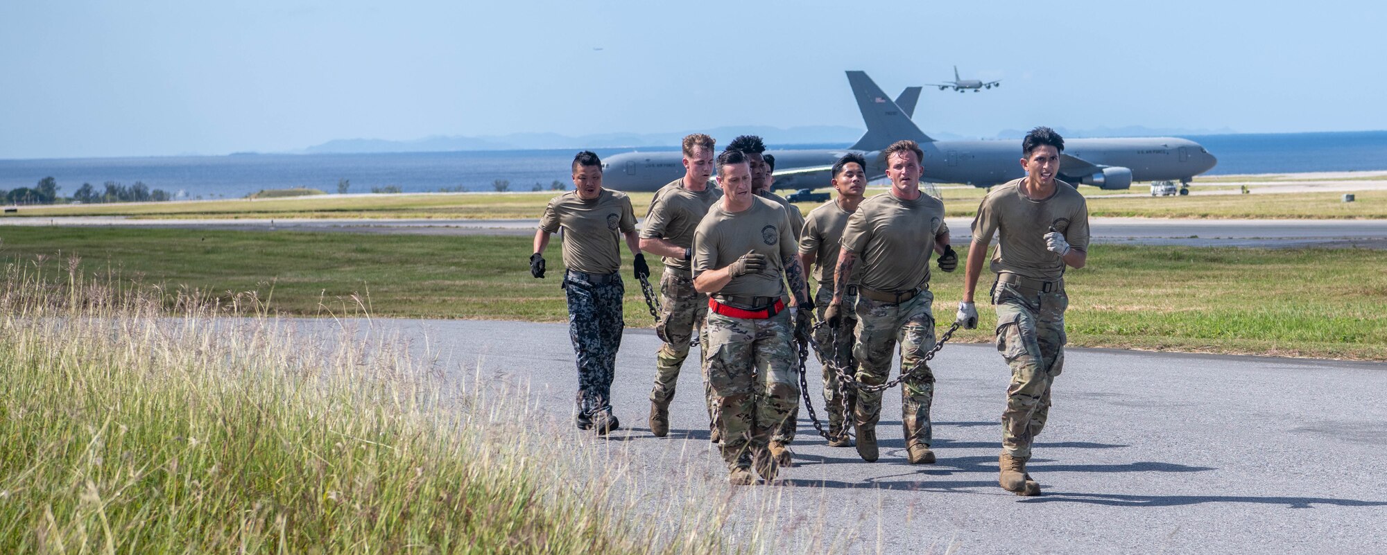 Japan Air Self-Defense Force and 733rd Air Mobility Squadron run alongside flight line for physical training