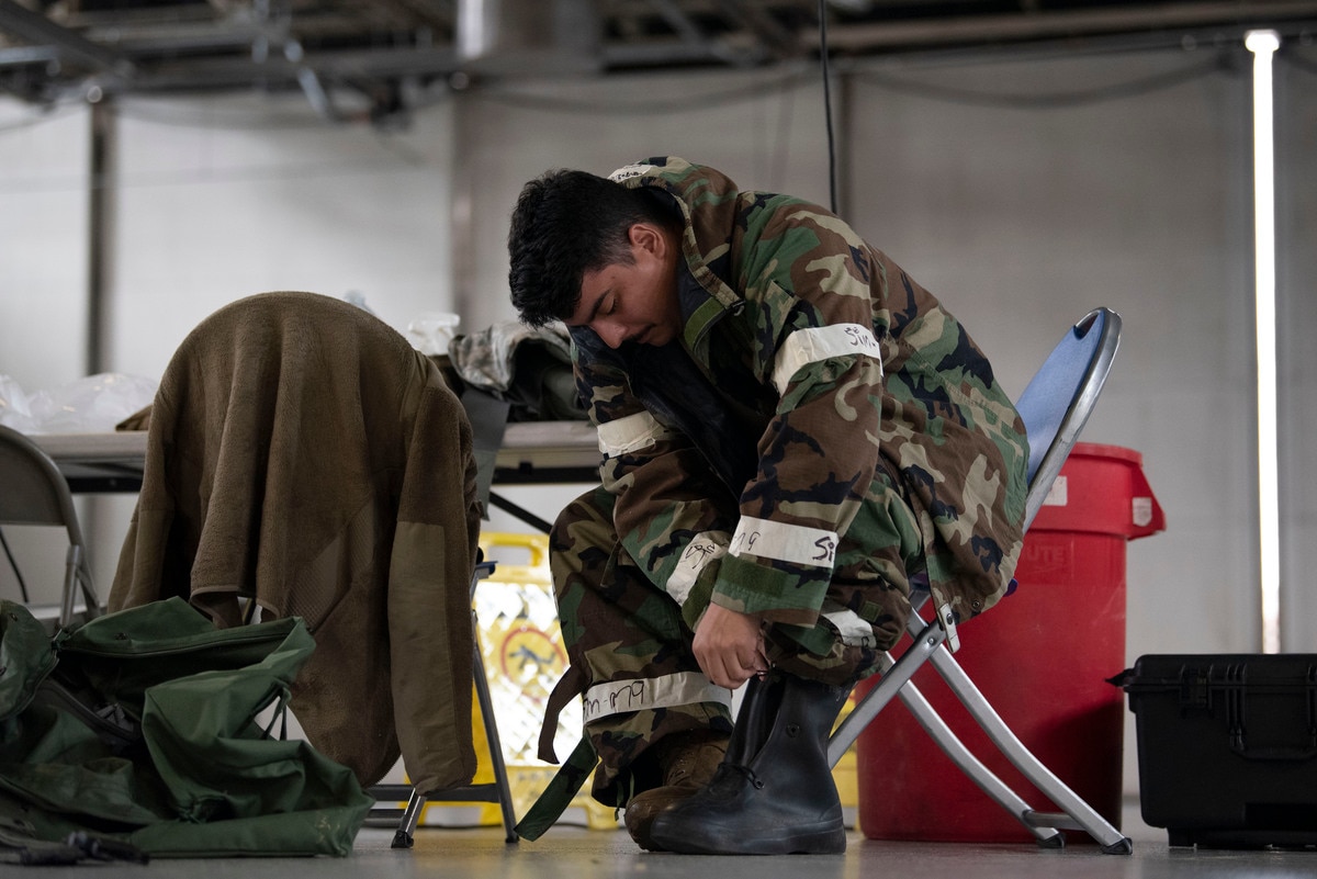 An Airman puts on protective gear