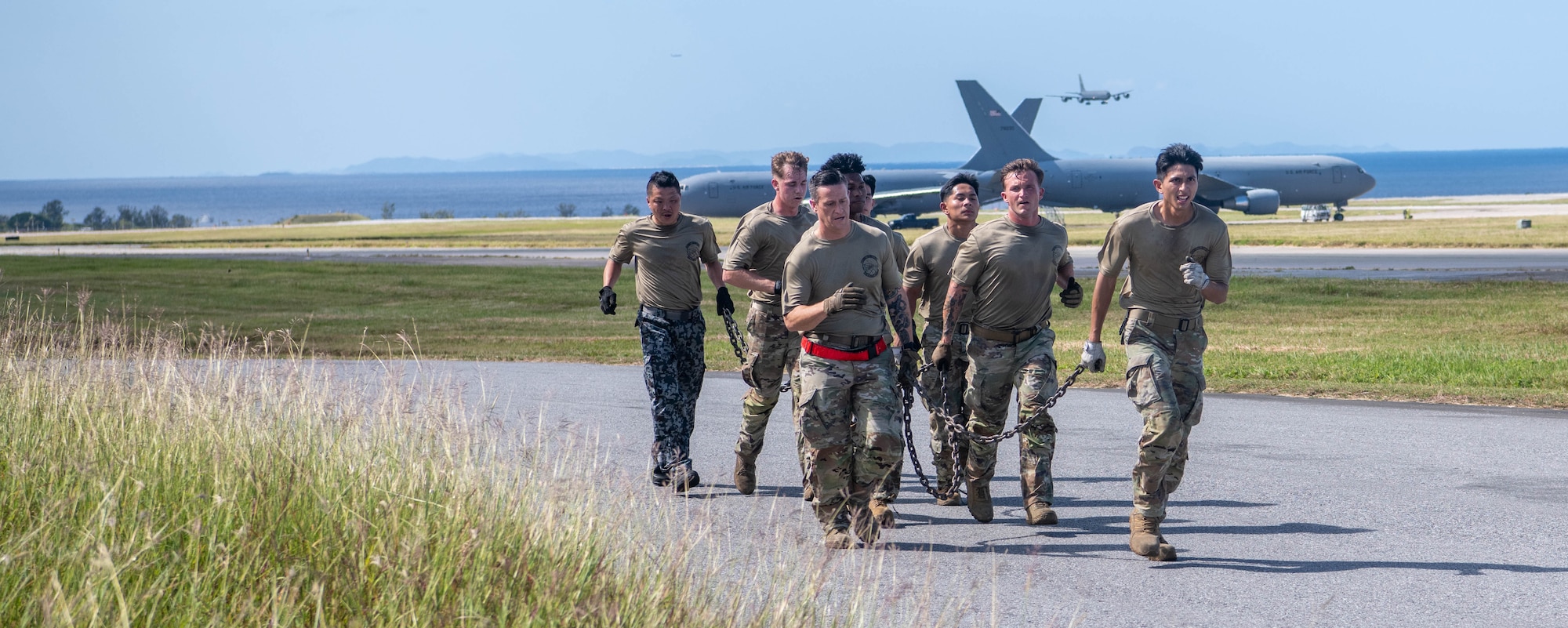 Japan Air Self-Defense Force and 733rd Air Mobility Squadron run alongside flight line for physical training