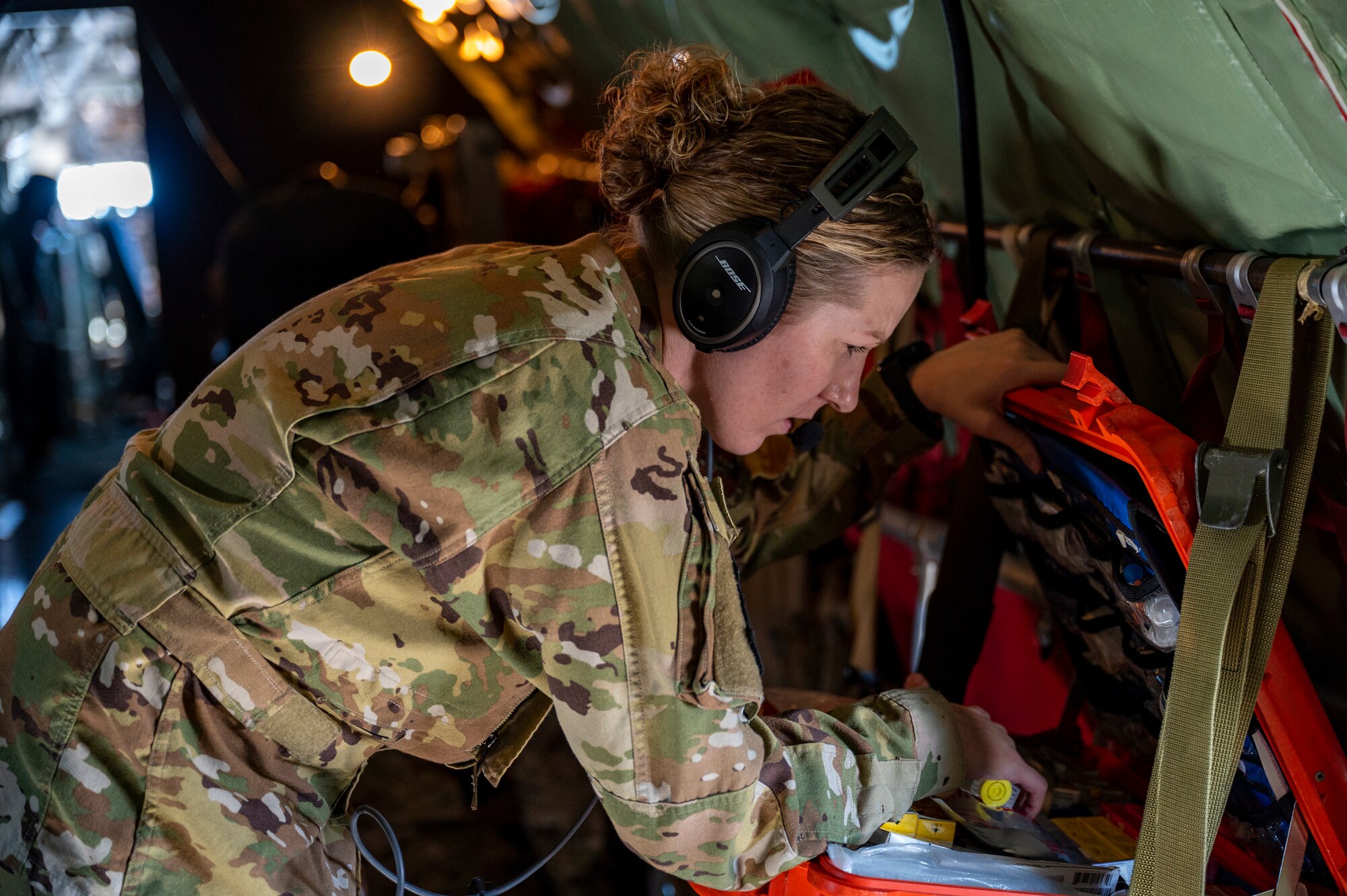 An Airman searching through medical equipment