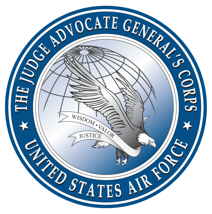 The Judge Advocate General's Corps, United States Air Force logo. Bald eagle wrapped in a ribbon with the text Wisdom, Valor, Justice (the JAG Corps' values) flying over a wire frame globe.