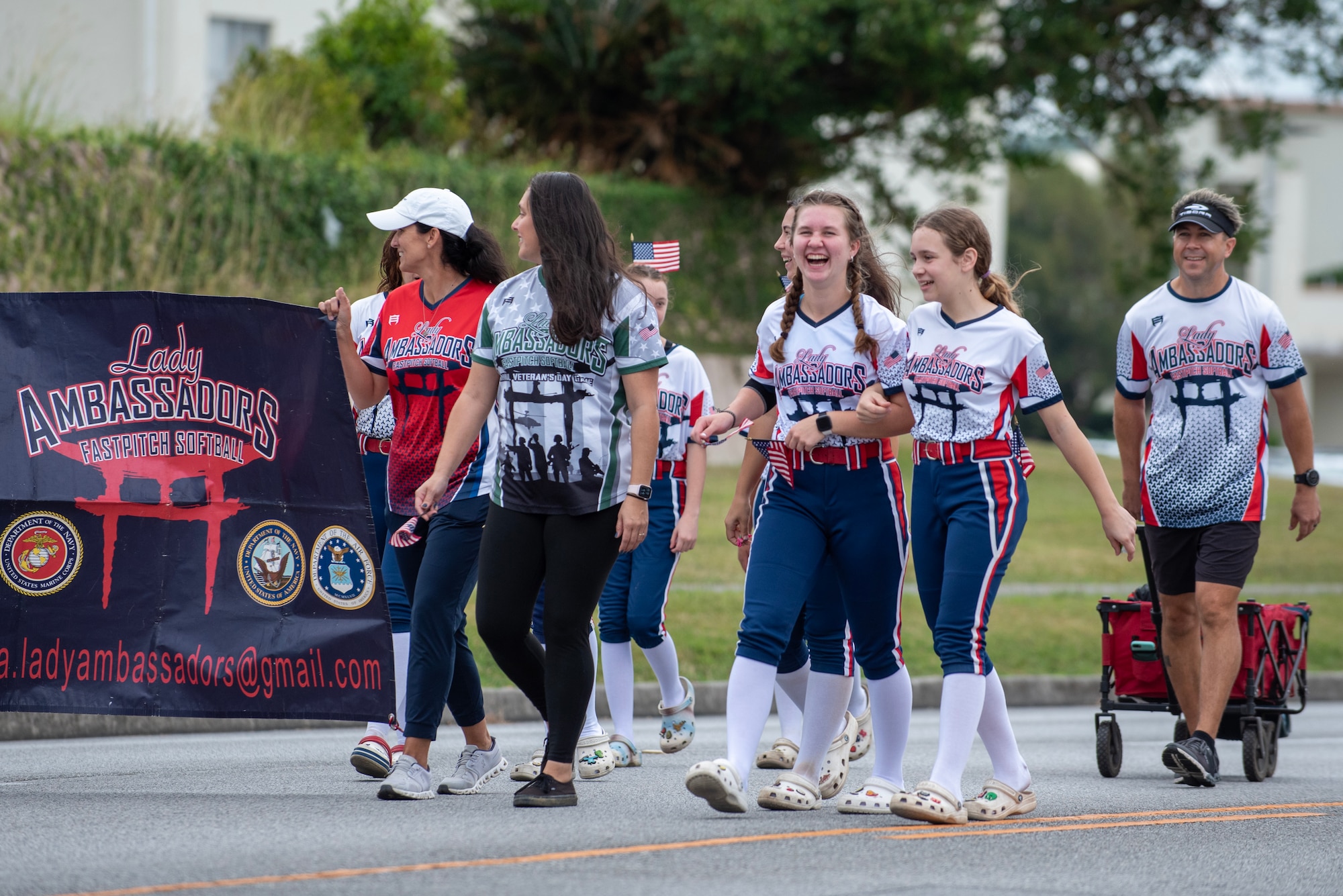 The Lady Ambassadors softball team from Kadena Air Base as a part of the base's Veterans day parade