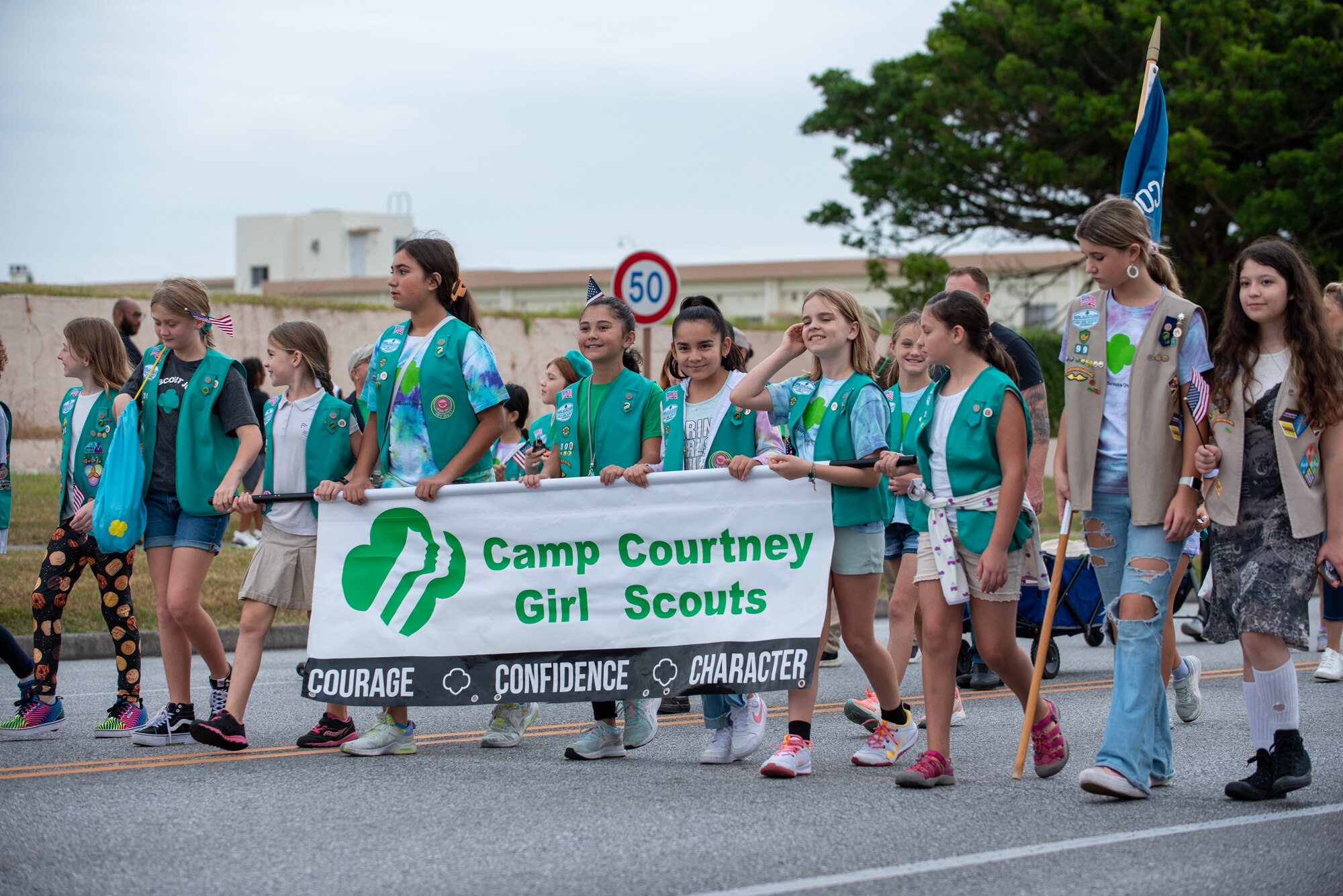 Girl Scouts from Camp Courtney march in Kadena Air Base's Veterans day parade