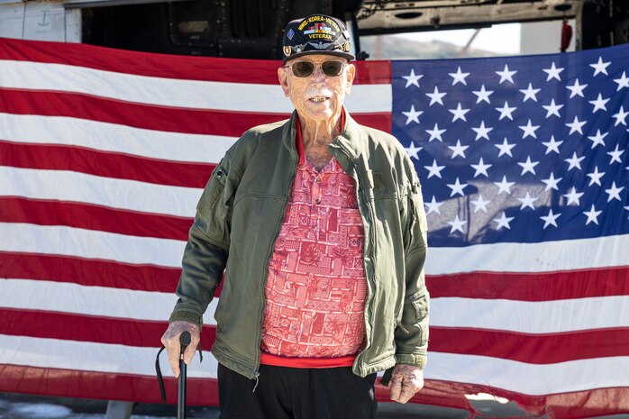 Retired U.S. Marine Corps and Army veteran Maj. Billy Hall takes a photo after an honor flight in a UH-1Y Venom with Marine Light Attack Helicopter Squadron 267, Marine Aircraft Group 39, 3rd Marine Aircraft Wing, at Marine Corps Air Station Camp Pendleton, California, Nov. 11, 2023. The 97-year-old veteran of World War II, Korea, and Vietnam celebrated the 82nd Anniversary of his Marine Corps Recruit Training graduation by flying with the Marines of HMLA-267.