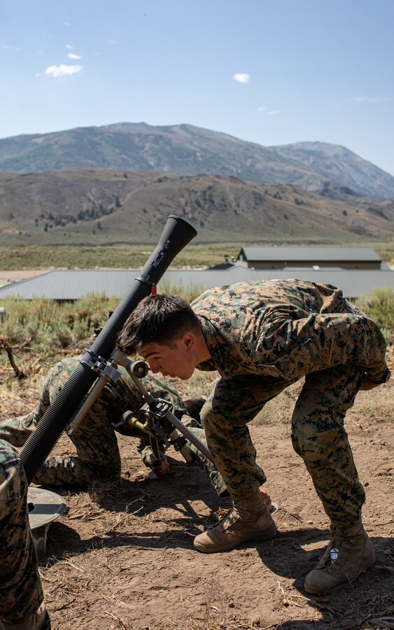 U.S. Marines with Weapons Company, 1st Battalion, 24th Marine Regiment, 4th Marine Division, Marine Forces Reserve, practice mortar firing drills at Marine Corps Mountain Warfare Training Center, Bridgeport, Calif., July 27, 2022, for Mountain Training Exercise 4-22. MTX 4-22 allowed reserve Marines to participate in mountain warfare operations for realistic combat training to facilitate increased readiness for the Marine Forces Reserve. (U.S. Marine Corps photo by Cpl. Jonathan L. Gonzalez)