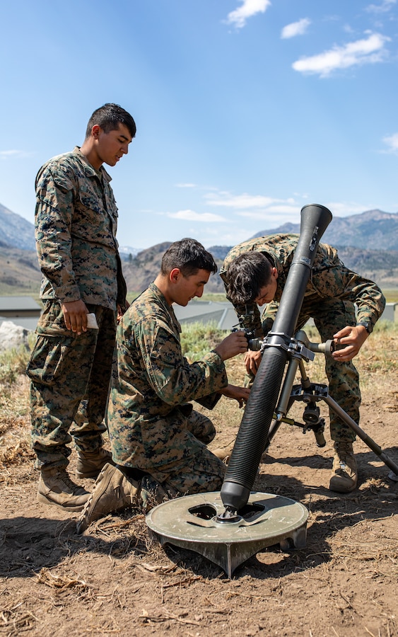 U.S. Marines with Weapons Company, 1st Battalion, 24th Marine Regiment, 4th Marine Division, Marine Forces Reserve, adjust an M67 mortar sight while conducting mortar training drills at Marine Corps Mountain Warfare Training Center, Bridgeport, Calif., July 27, 2022, for Mountain Training Exercise 4-22. MTX 4-22 allowed reserve Marines to participate in mountain warfare operations for realistic combat training to facilitate increased readiness for the Marine Forces Reserve. (U.S. Marine Corps photo by Cpl. Jonathan L. Gonzalez)