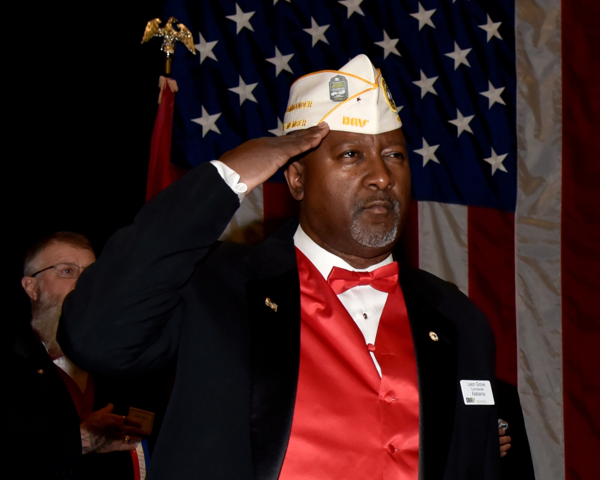 Leon Grove, U.S. Marine Corps. veteran and commander of the Department of Alabama, salutes during the 76th National Veterans Day awards dinner hosted by the National Veterans Day Foundation on Nov. 10, 2023, in Birmingham, Alabama. A perpetual National Veterans Award was created in Birmingham for America’s first official National Veterans Day observance on November 11, 1954 as authorized by Congress. Its purpose is to honor an outstanding veteran in the United States each year who has made the greatest contribution to further the patriotic interests of veterans and veteran organizations throughout the country; and the award is presented at the National Veterans Award Dinner in Birmingham. (U.S. Air National Guard photo by Staff Sgt. Shelby Thurman)