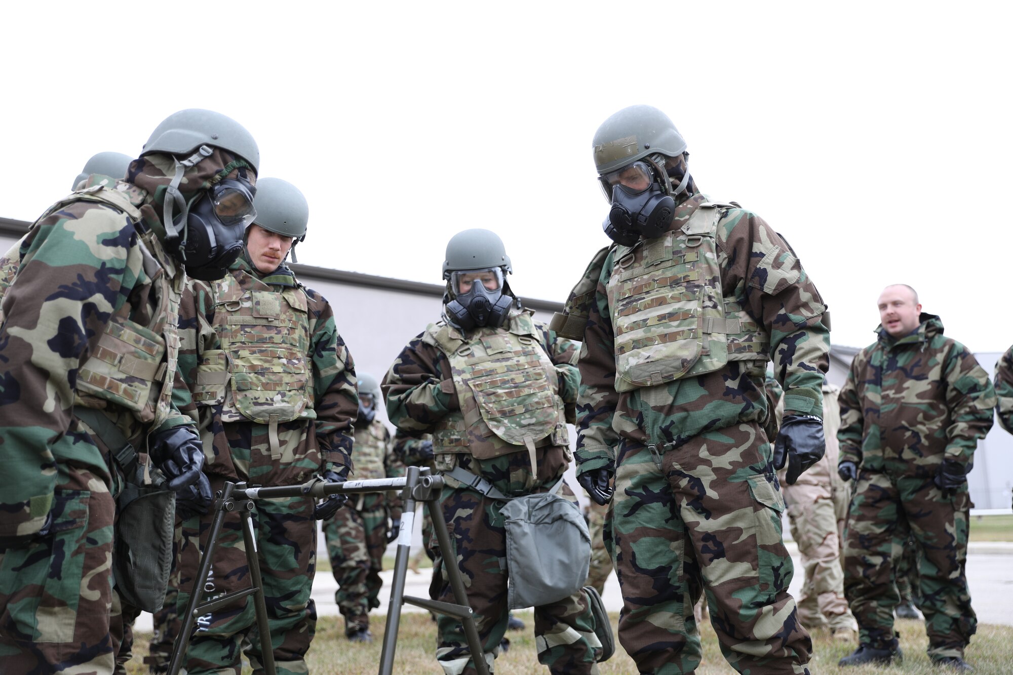 Members of the 445th Aeromedical Staging Squadron inspect a mock liquid detection point during a chemical, biological, radiological, nuclear and high yield explosive (CBRNE) exercise at Wright-Patterson Air Force Base, Oct 15, 2023. The CBRNE drill simulated post attack reconnaissance including the detection, safe handling and reporting of nerve agents.