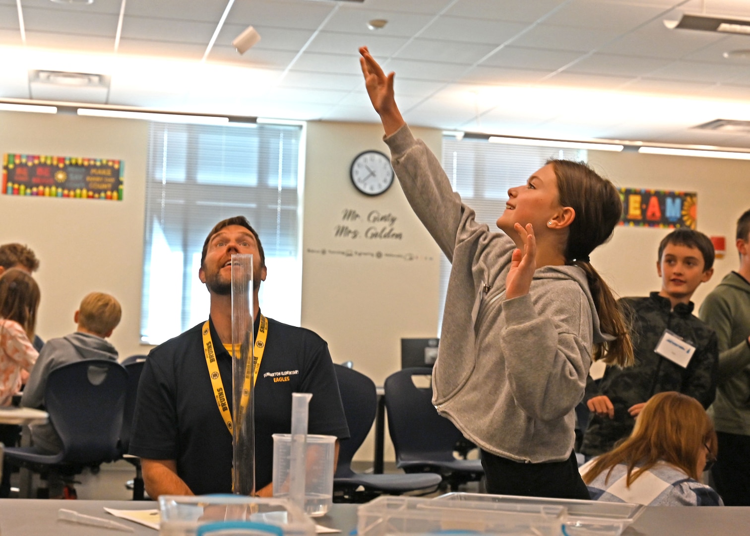 Principal Tim Vasconcellos and Leighton Filiau of Dunbarton Elementary School conduct an Alka-Seltzer rocket propulsion experiment Nov. 13, 2023, at the New Hampshire National Guard’s Edward Cross Training Complex in Pembroke.