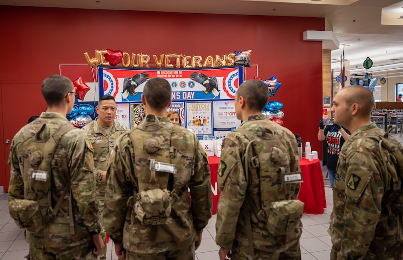 U.S. Army Advanced Individual Training students from the 128th Aviation Brigade discuss what it means to be a veteran with Col. Frankie Cochiaosue, 733d Mission Support Group commander at Joint Base Langley-Eustis, Virginia, Nov. 10, 2023.