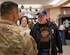 U.S. Army Col. Frankie Cochiaosue, 733d Mission Support Group commander thanks an U.S. Air Force veteran for his service with a free limited-edition Veteran’s Day coin in recognition of protecting our way of life at Joint Base Langley-Eustis, Virginia, Nov. 10, 2023.