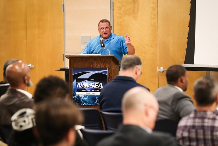 Naval Surface Warfare Center Indian Head Division modernization plan program manager Jim Sherman addresses the attendees at an Industry Day for infrastructure contractors in southern Maryland for the construction and architecture/engineering trades in preparation for the command's modernization efforts.