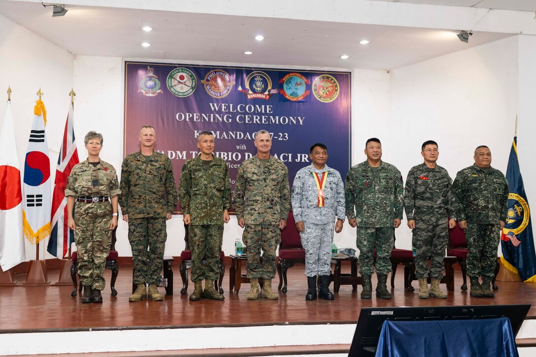 Leading representatives from the U.S., Philippines, Republic of Korea, and service members from the Japanese Ground Self-Defense Force, the United Kingdom, pose for a photo during the KAMANDAG 7 opening ceremony on Fort Bonifacio, Manila, Philippines, Nov. 9, 2023. KAMANDAG is an annual Philippine Marine Corps and U.S. Marine Corps led exercise aimed at improving multinational readiness, alliances, and mutual capabilities in the advancement of a free and open Indo-Pacific. This year marks the seventh iteration of this exercise and includes participants from Japan, the Republic of Korea, and observers from the United Kingdom. (U.S. Marine Corps photo by Gunnery Sgt. Natalie Velazquez)