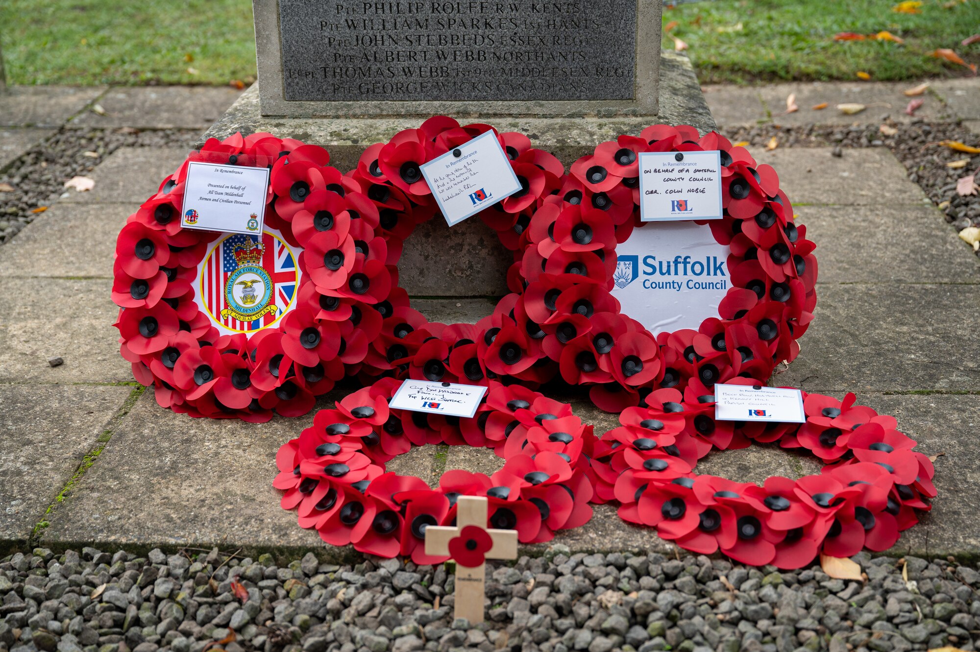 Wreaths lay on a monument after U.S. Air Force Senior Enlisted Leaders assigned to Royal Air Force Mildenhall and members of the Beck Row community, pay their respects on Remembrance Day, Beck Row, England, Nov. 12, 2023.