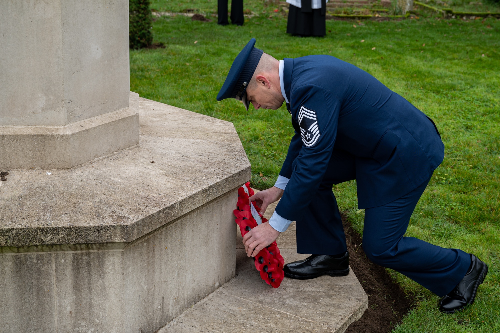 U.S. Air Force Chief Master Sgt. Joel Ellis, 752nd Special Operations Aircraft Maintenance Squadron senior enlisted leader, places a wreath on a monument during Remembrance Day, Beck Row, England, Nov. 12, 2023.