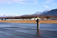 Civil Air Patrol Cadet Capt. Rick Benedict, a fifteen-year-old assigned to the Birchwood Composite Squadron, uses a receiver to measure signal strength to locate a distress beacon during a three-day training event Nov. 4, 2023, at the Birchwood Airport in Chugiak, Alaska. The training is part of the CAP wing-wide Search and Rescue Exercise, a quarterly event designed to test participants’ skill sets, leadership qualities, and resourcefulness. (Alaska National Guard photo by Balinda O’Neal)