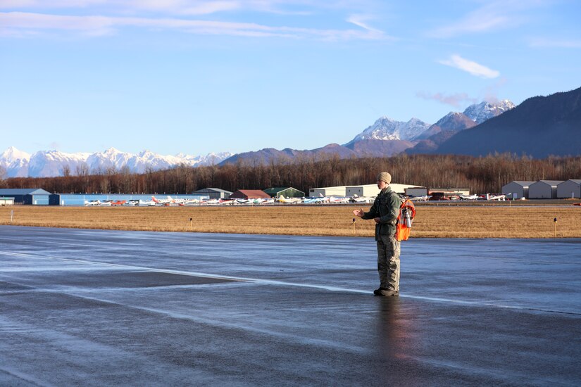 Civil Air Patrol Cadet Capt. Rick Benedict, a fifteen-year-old assigned to the Birchwood Composite Squadron, uses a receiver to measure signal strength to locate a distress beacon during a three-day training event Nov. 4, 2023, at the Birchwood Airport in Chugiak, Alaska.