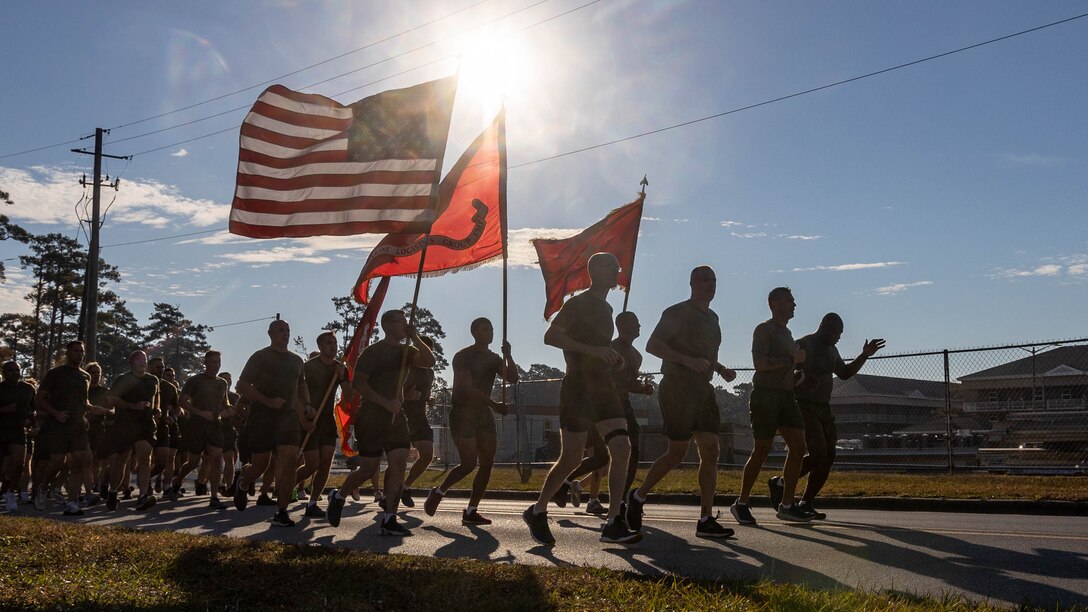 U.S. Marines with 2nd Marine Logistics Group, conduct a Marine Corps Birthday celebration formation run on Camp Lejeune, North Carolina, Nov. 9, 2023. 2nd MLG conducted the formation run through the French Creek area to build camaraderie and celebrate the 248th birthday of the United States Marine Corps. (U.S. Marine Corps Photo by Lance Cpl. Alfonso Livrieri)