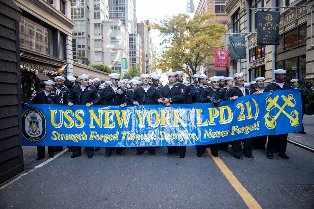 U.S. Sailors with USS New York (LPD-21) participate in the New York Veteran's day parade at New York City, New York, Nov 11, 2023. U.S. Marines and Sailors participate in events in and around New York City during the week-long Veterans Day New York celebration to honor the service and sacrifice of the nation’s veterans. (U.S. Marine Corps photo by Lance Cpl. Jacquilyn Davis)