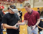 A student uses a virtual reality device at Sinclair Community College’s Manufacturing Day event.