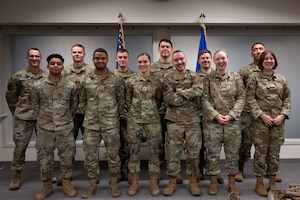 Airmen pose for a group photo.