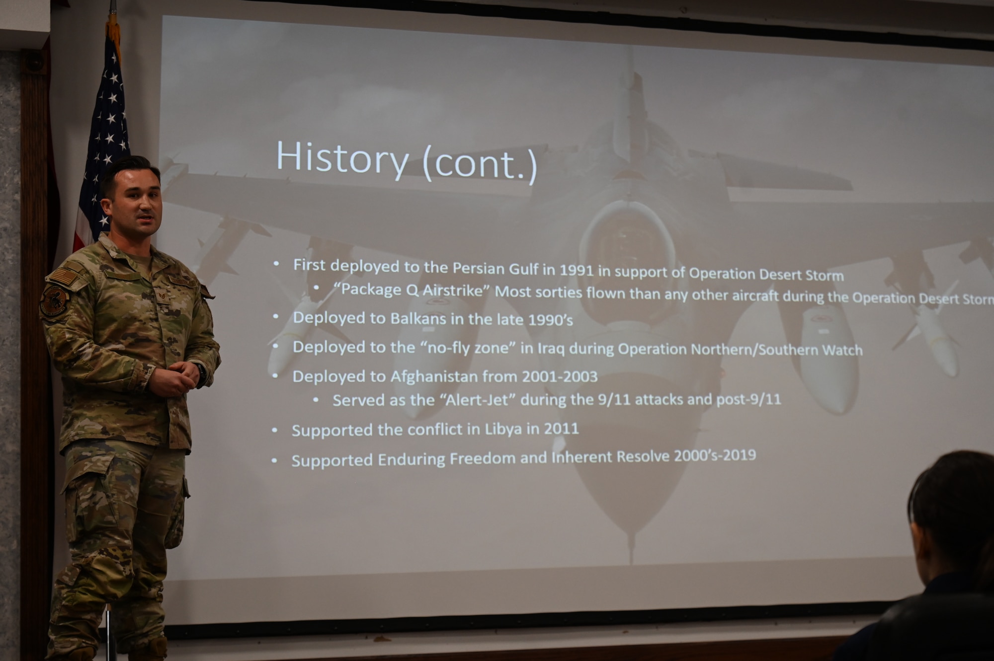 U.S. Air Force Staff Sgt. Stephen Lentz, 87th Electronic Warfare Squadron Combat Shield avionics journeyman, briefs on the F-16 Fighting Falcon during a visit to the wing by Pensacola High School Air Force JROTC cadets at Eglin Air Force, Fla., Nov. 1, 2023. The 87th EWS conducts the Combat Shield mission, which assesses defensive system readiness of Combat Air Forces (CAF) aircraft by deploying assessment teams with specialized equipment to provide senior leadership an independent assessment of the over health of CAF systems. (U.S. Air Force photo by Capt. Benjamin Aronson)