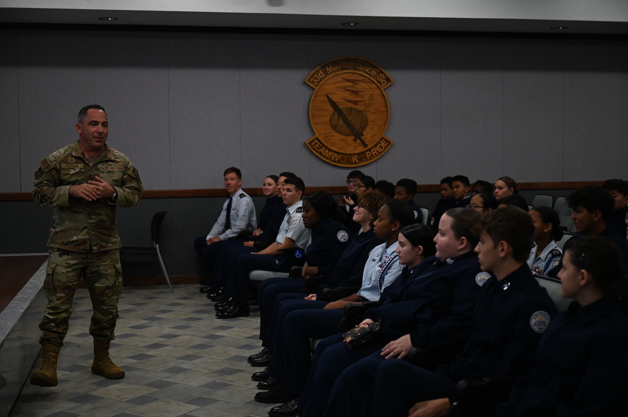 U.S. Air Force Col. Josh Koslov, 350th Spectrum Warfare Wing commander, answers questions from Pensacola High School Air Force JROTC cadets during a wing visit at Eglin Air Force, Fla., Nov. 1, 2023. Cadets visited the 350th SWW to learn more about the operational Air Force, the wing’s mission to provide expert Electronic Warfare support and attack as well as learn about future career opportunities. (U.S. Air Force photo by Capt. Benjamin Aronson)