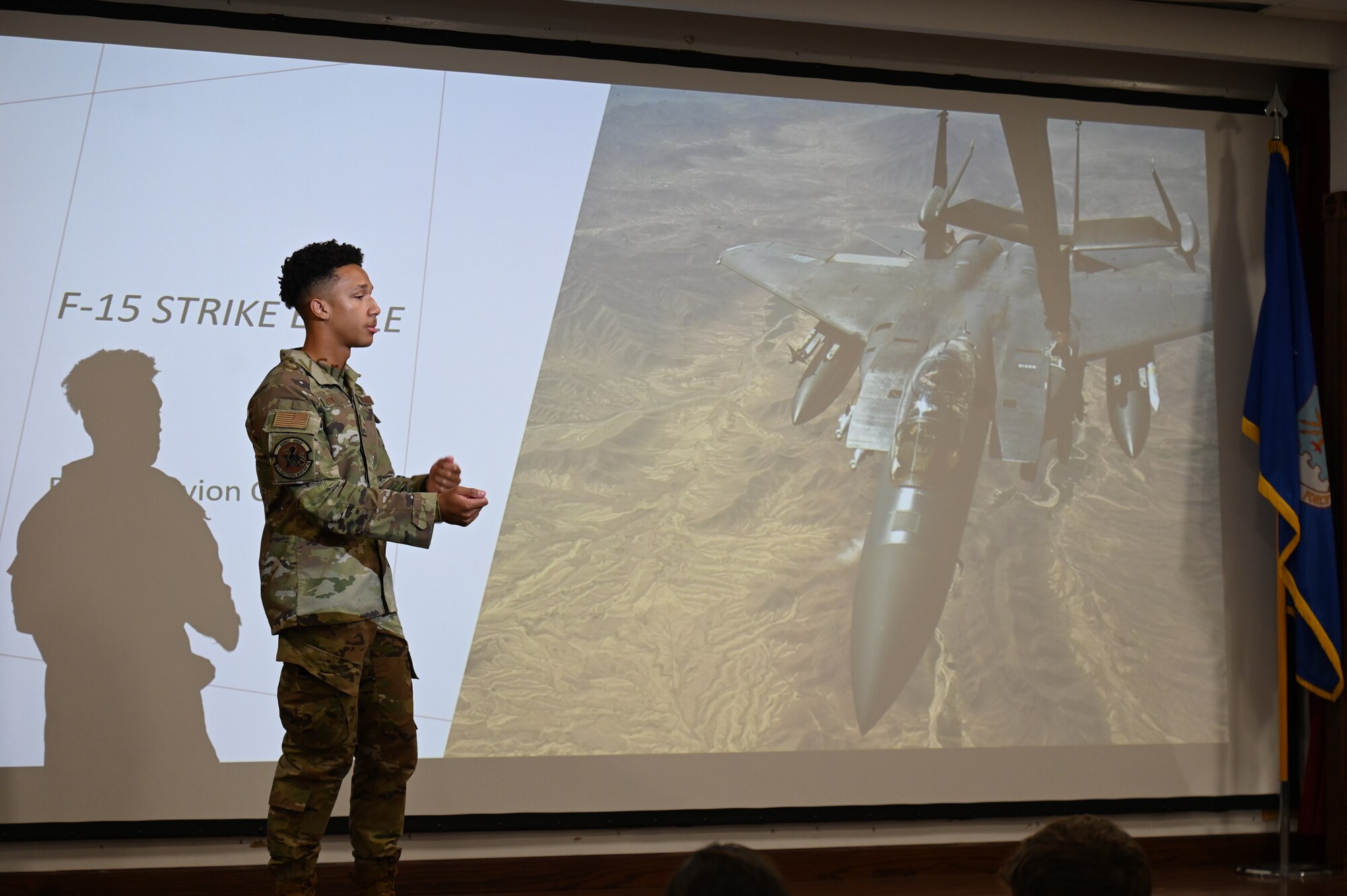 U.S. Air Force Senior Airman Tavion Cox, 87th Electronic Warfare Squadron Combat Shield avionics journeyman, briefs on the maintenance of the F-15E Strike Eagle to Pensacola High School Air Force JROTC cadets during a wing tour at Eglin Air Force, Fla., Nov. 1, 2023. The 87th EWS conducts the Combat Shield mission, which assesses defensive system readiness of Combat Air Forces (CAF) aircraft by deploying assessment teams with specialized equipment to provide senior leadership an independent assessment of the over health of CAF systems. (U.S. Air Force photo by Capt. Benjamin Aronson)