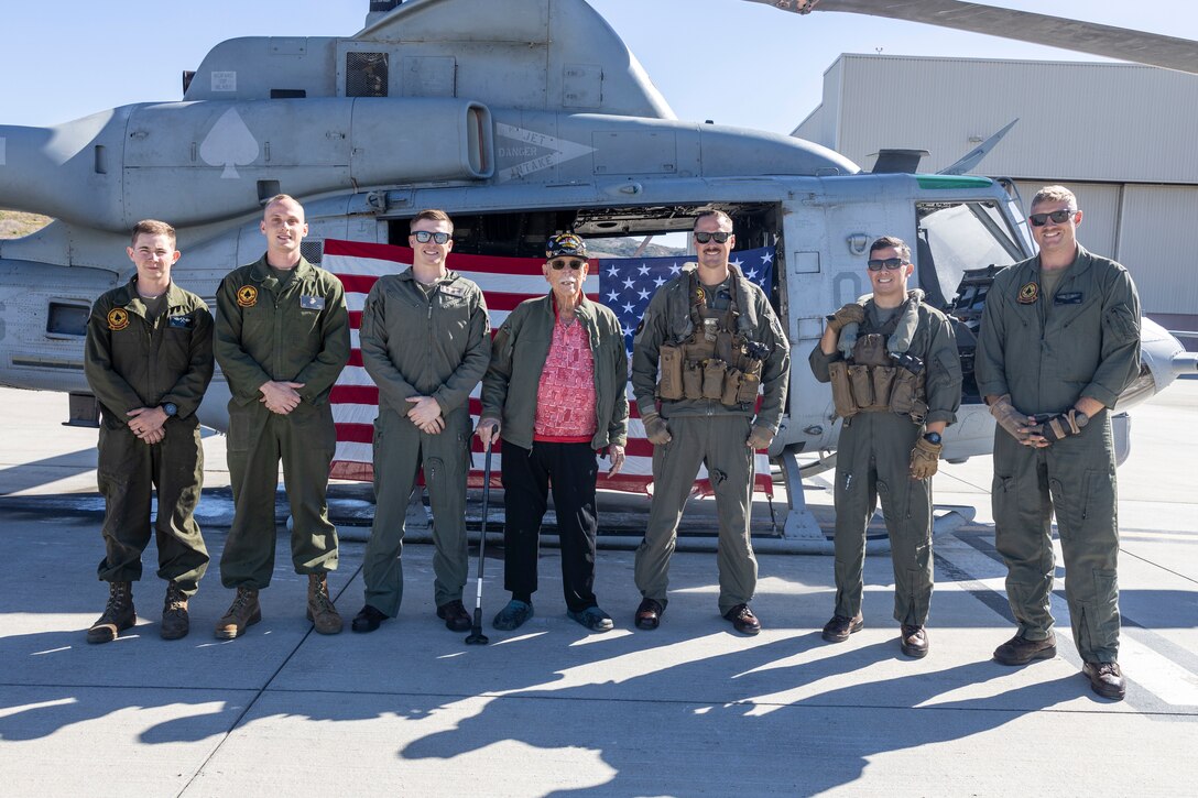 Retired U.S. Marine Corps and Army veteran Maj. Billy Hall, thanks the Marines of Marine Light Attack Helicopter Squadron (HMLA) 267, Marine Aircraft Group 39, 3rd Marine Aircraft Wing, after an honor flight in a UH-1Y Venom with HMLA-267, MAG-39, 3rd MAW, at Marine Corps Air Station Camp Pendleton, California, Nov. 11, 2023. The 97-year-old veteran of World War II, Korea, and Vietnam celebrated the 82nd anniversary of his Marine Corps Recruit Training graduation by flying with the Marines of HMLA-267. (U.S. Marine Corps photo by Sgt. Sean Potter)