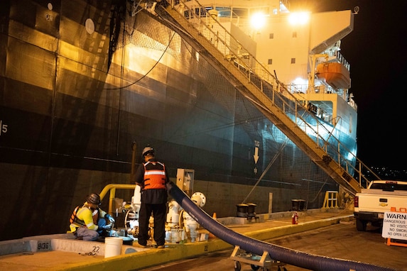 Members in support of Joint Task Force-Red Hill (JTF-RH) inspect the quality of fuel from the Red Hill Bulk Fuel Storage Facility (RHBFSF), during routine nighttime operations at Joint Base Pearl Harbor-Hickam, Hawaii, Nov. 7, 2023.