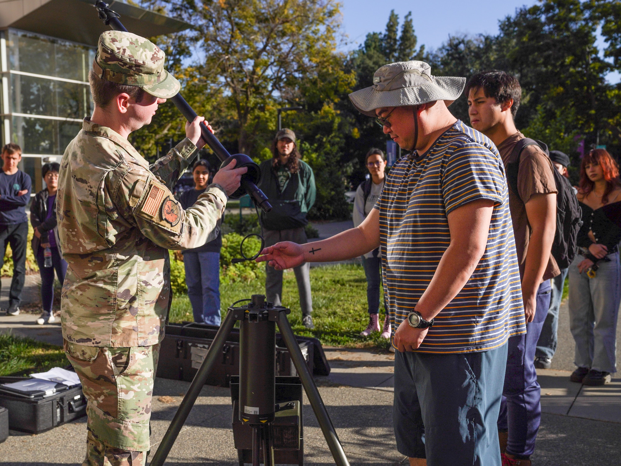 U.S. Force Tech Sgt. Zachary Cash, 9th Operations Support Squadron weather forecaster demonstrates the assembly and capabilities of a tactical meteorological observing system at the University of California, Davis, on Nov. 07, 2023.
