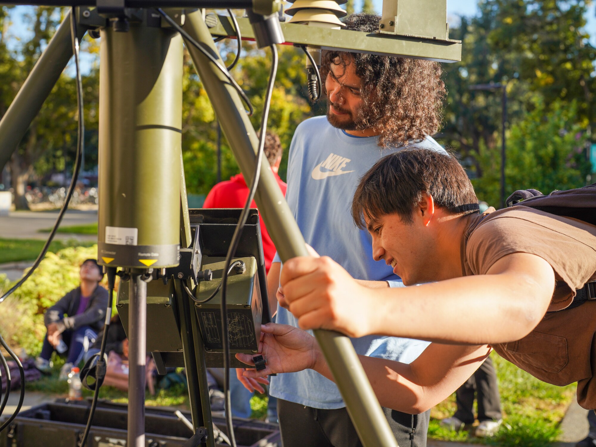 Ivan Agudelo, a senior at the University of California, Davis (left) and Nicholas Picoleau, a junior at the University of California, Davis (right) volunteer to help assemble a tactical meteorological observation system (TMOS) at the University of California, Davis, Nov. 07, 2023.