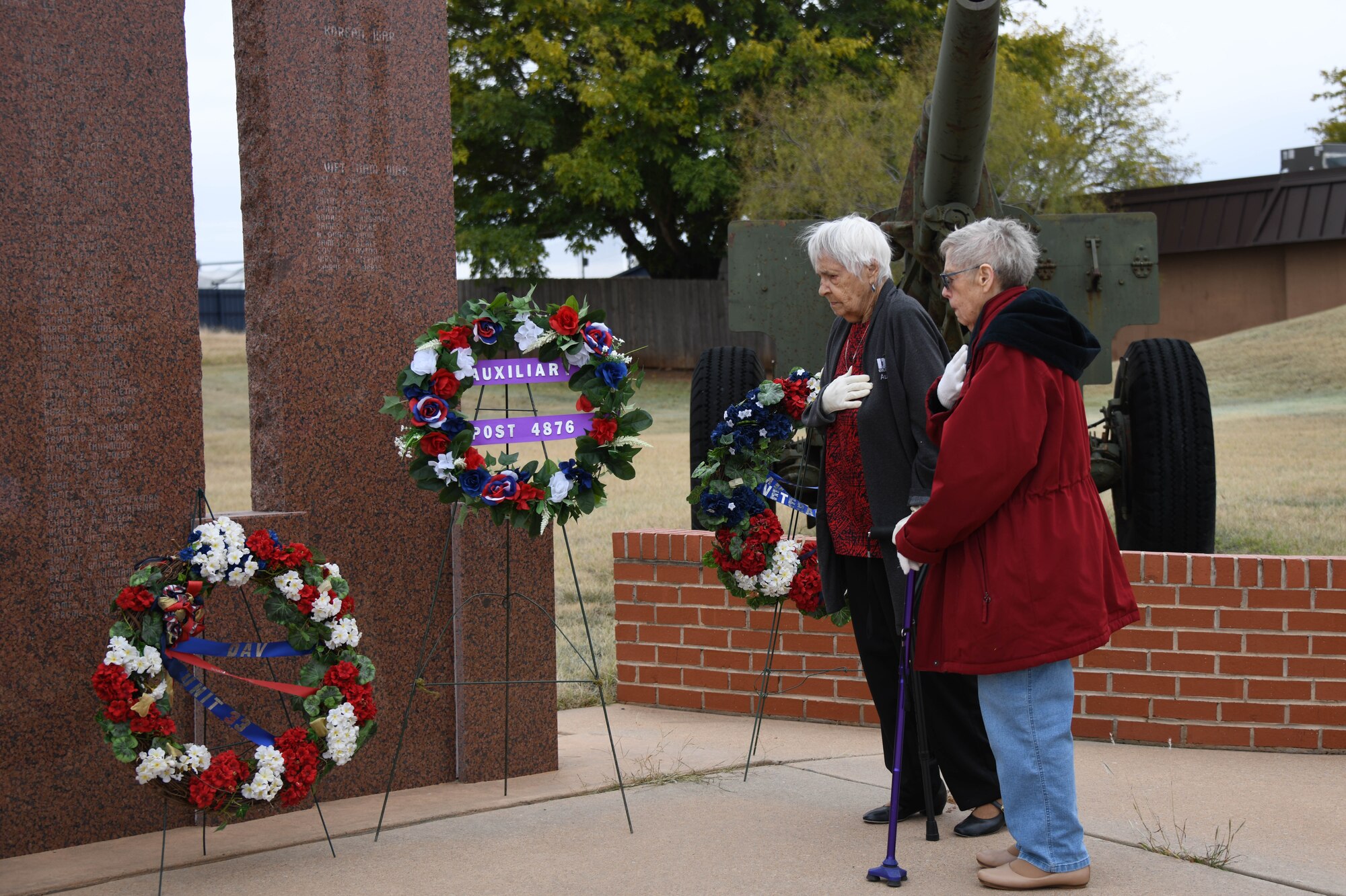 Arvella Mote and Luella Williams, Civil American Veterans auxiliary presidents, salute after placing a wreath at the Jackson County War Memorial in Altus, Oklahoma, Nov. 11, 2023. Auxiliary members are family members of those who have served. (U.S. Air Force photo by Senior Airman Miyah Gray)