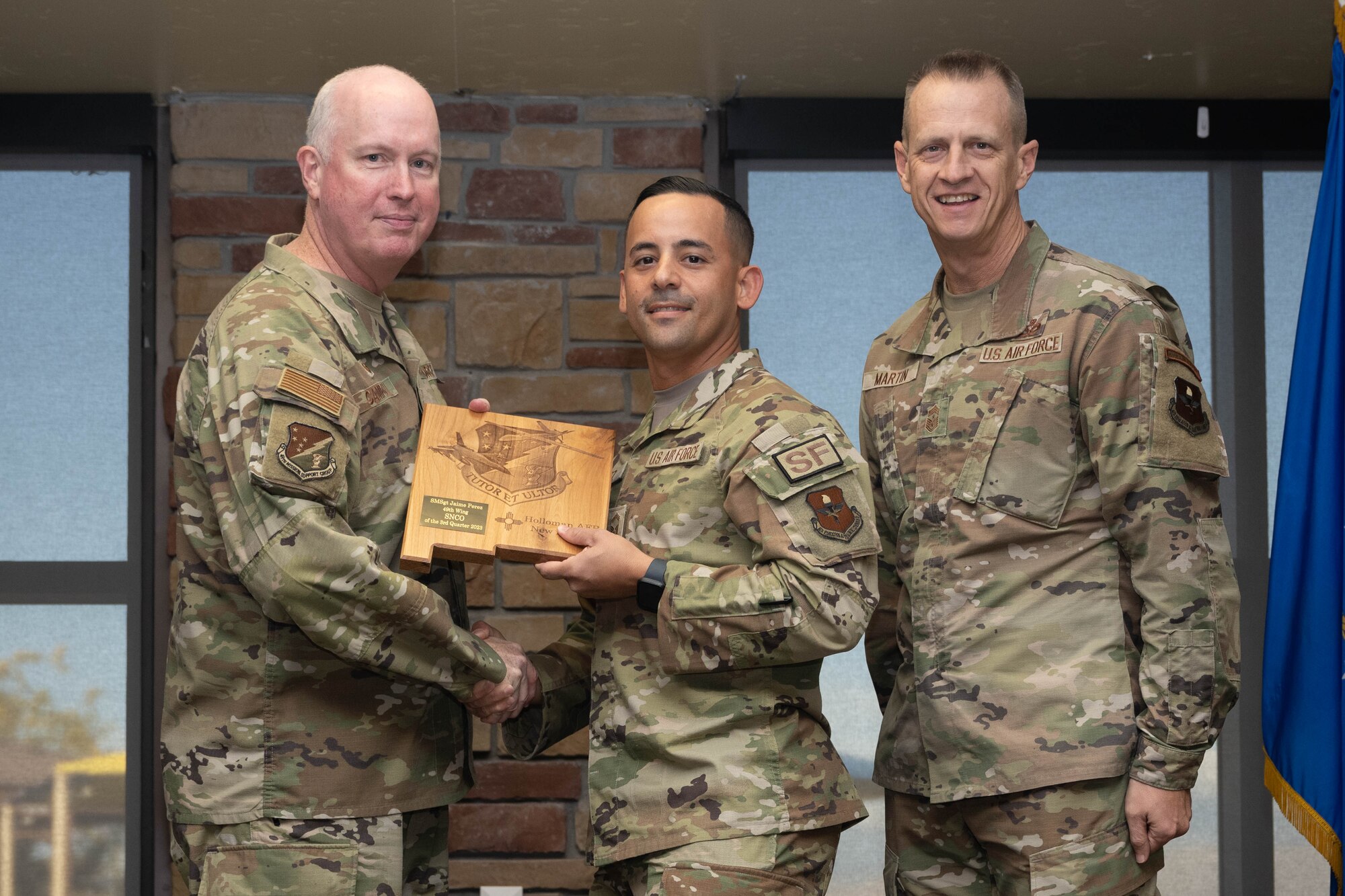 U.S. Air Force Senior Master Sgt. Jaime Perez, from the 49th Security Forces Squadron, accepts the Senior Noncommissioned Officer of the Quarter Award, during the 49th Wing’s 3rd Quarter Award ceremony at Holloman Air Force Base, New Mexico, November 9, 2023. Quarterly award winners were selected based on their technical expertise, demonstration of leadership and job performance. (U.S. Air Force photo by Airman 1st Class Bob Teichmann)