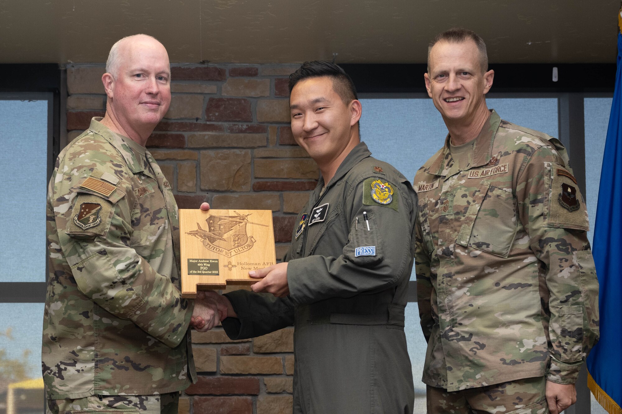 U.S. Air Force Maj. Andrew Kwon, from the 49th Wing Staff Agency, accepts the Field Grade Officer of the Quarter Award, during the 49th Wing’s 3rd Quarter Award ceremony at Holloman Air Force Base, New Mexico, November 9, 2023. Quarterly award winners were selected based on their technical expertise, demonstration of leadership and job performance. (U.S. Air Force photo by Airman 1st Class Bob Teichmann)