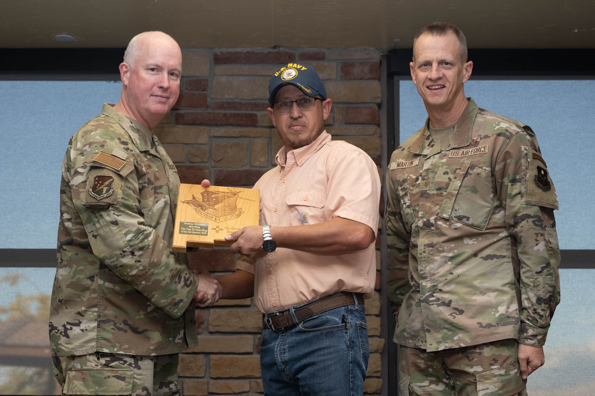 Robbie Winters from the 49th Medical Group, accepts the Category II Non-Supervisory Civilian of the Quarter Award during the 49th Wing’s 3rd Quarter Award ceremony at Holloman Air Force Base, New Mexico, November 9, 2023. Quarterly award winners were selected based on their technical expertise, demonstration of leadership and job performance. (U.S. Air Force photo by Airman 1st Class Bob Teichmann)