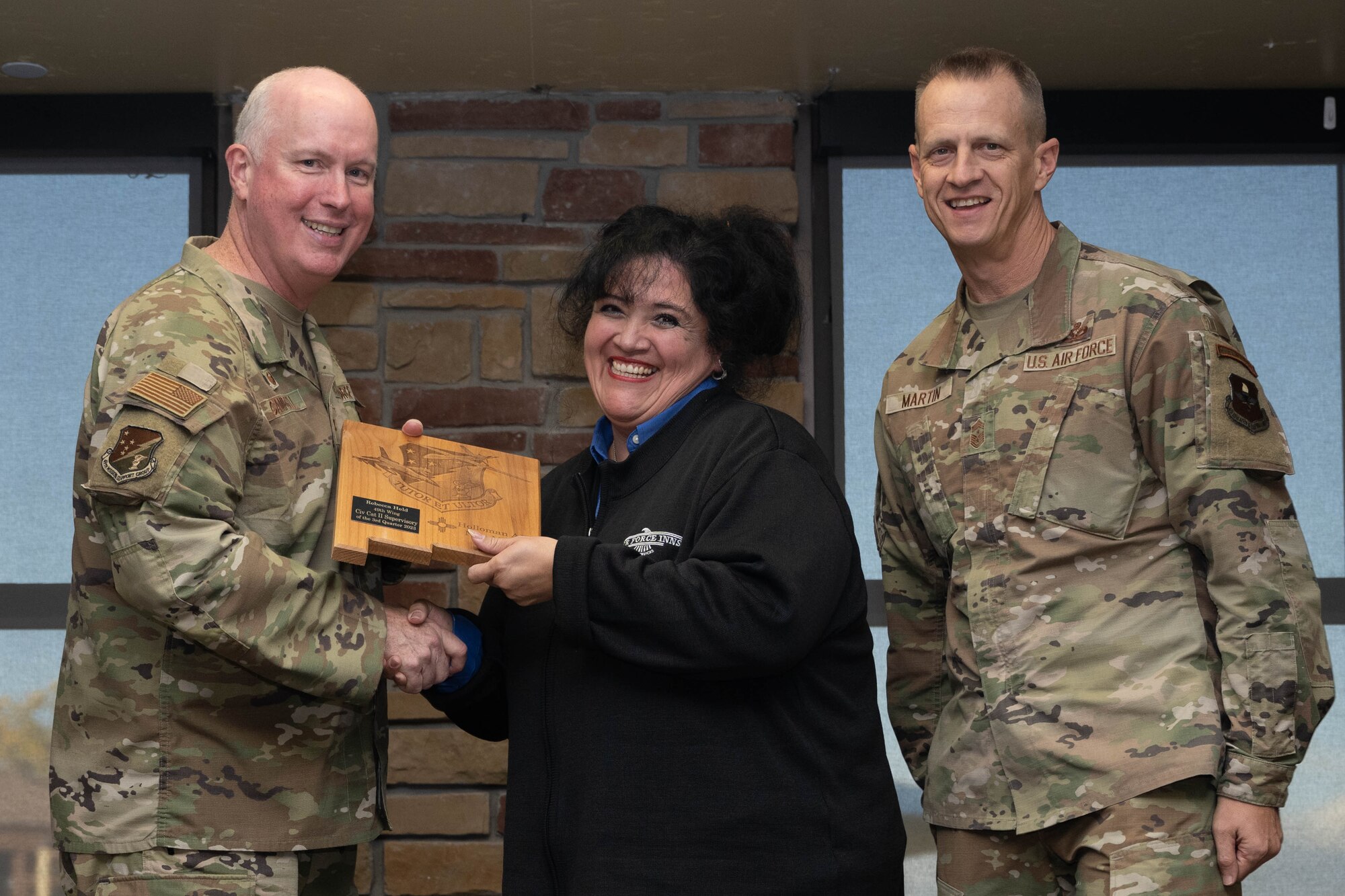 Rebecca Held from the 49th Mission Support Group, accepts the Category II Supervisory Civilian of the Quarter Award during the 49th Wing’s 3rd Quarter Award ceremony at Holloman Air Force Base, New Mexico, November 9, 2023. Quarterly award winners were selected based on their technical expertise, demonstration of leadership and job performance. (U.S. Air Force photo by Airman 1st Class Bob Teichmann)
