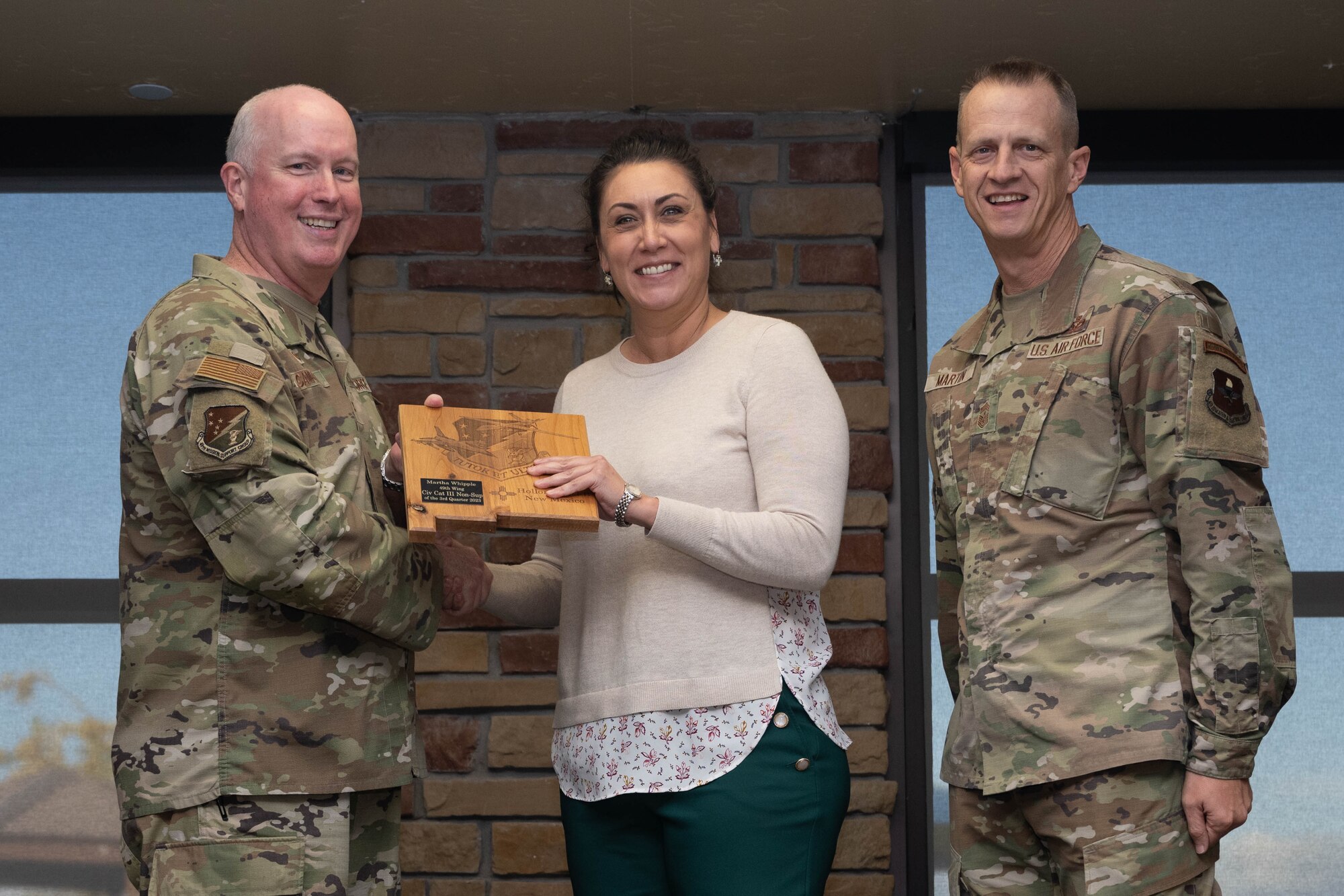 Martha Whipple from the 49th Wing Staff Agency accepts the Category III Non-Supervisory Civilian of the Quarter Award during the 49th Wing’s 3rd Quarter Award ceremony at Holloman Air Force Base, New Mexico, November 9, 2023. Quarterly award winners were selected based on their technical expertise, demonstration of leadership and job performance. (U.S. Air Force photo by Airman 1st Class Bob Teichmann)