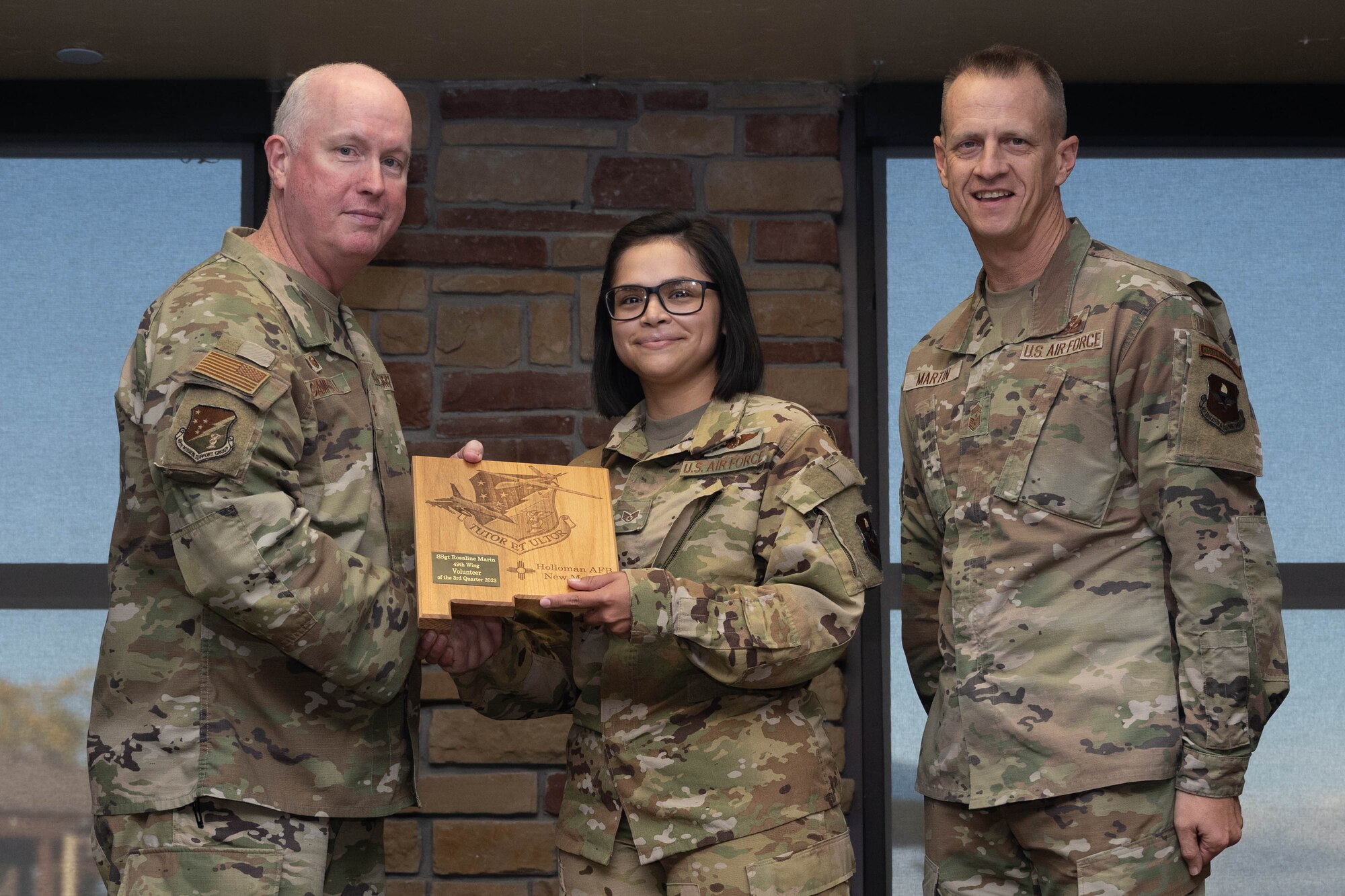U.S. Air Force Staff Sgt. Rosaline Marin from the 49th Operations Group accepts the Volunteer of the 2nd Quarter Award during the 49th Wing’s 3rd Quarter Award ceremony at Holloman Air Force Base, New Mexico, November 9, 2023. Quarterly award winners were selected based on their technical expertise, demonstration of leadership and job performance. (U.S. Air Force photo by Airman 1st Class Bob Teichmann)